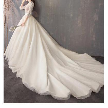 Handmade Elegant Long-sleeved Beaded Wedding Dress..