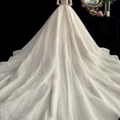 Handmade Luxury Ivory Transparent Wedding Gown..