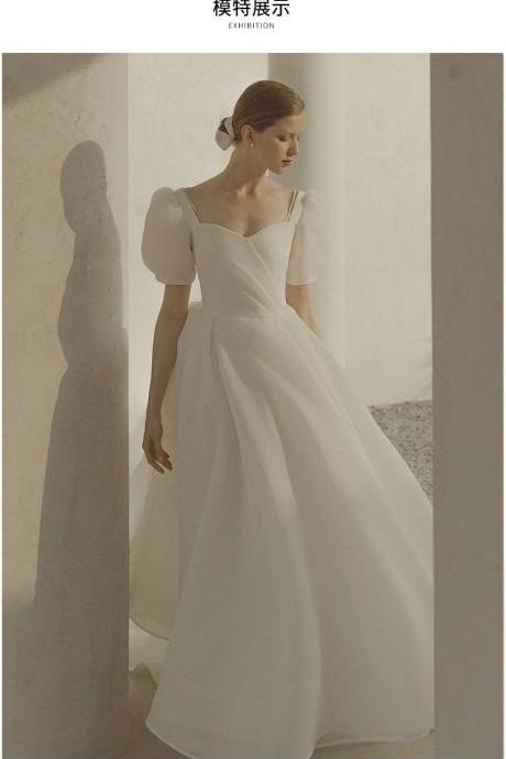 Elegant lantern-sleeved wedding gown with strapless bridal gown